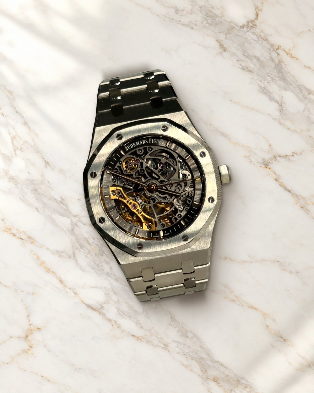 Audemars Piguet Royal Oak openworked skeleton watch in steel, from our showroom, on white marble